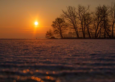 Sunset Over Snowy Field