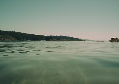 Calm Sea with Green Coastline
