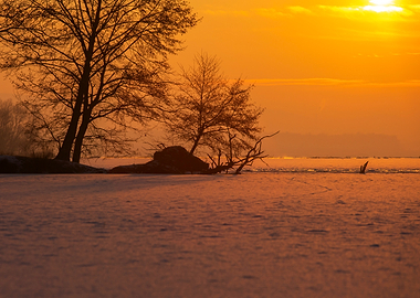 Sunset Over Frozen Lake