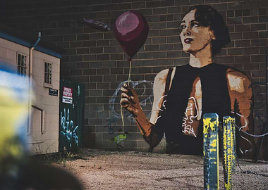 Street Art Mural of Woman with Balloon