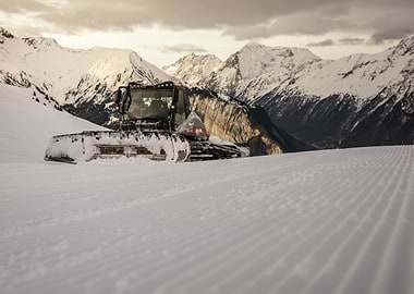 Snowcat in Mountain Landscape