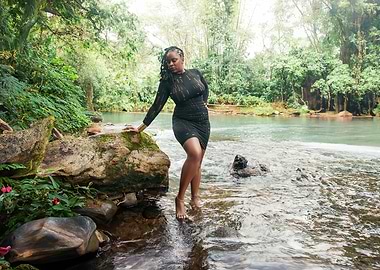 Woman in Black Dress by River