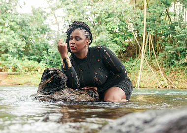 Woman in Black Dress by River
