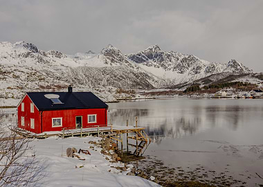 Red Cabin by Snowy Mountains