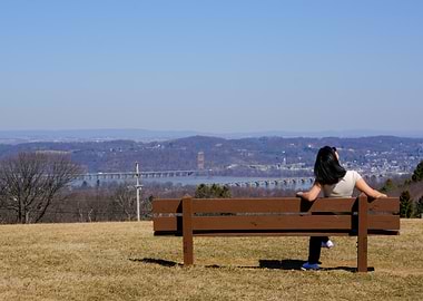 Woman on Bench with River View