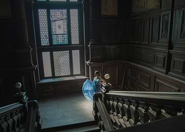 Woman in Blue Dress on Grand Staircase
