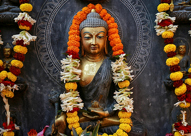 Buddha Statue with Flower Garlands