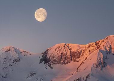 Full Moon Over Snowy Peaks