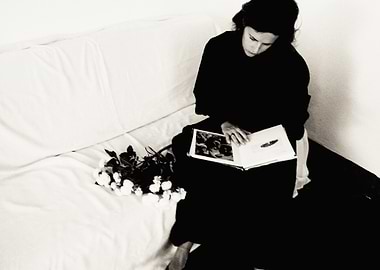 Woman Reading Book on Couch