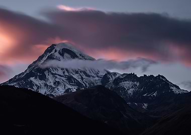 Snowy Mountain Peak at Sunset