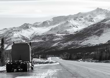 Truck on Snowy Mountain Road