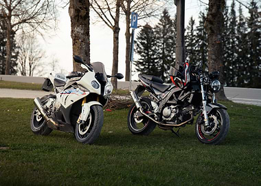 Two Parked Motorcycles on Green Grass