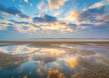 Reflective Beach at Sunrise