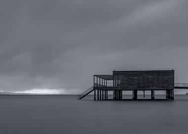 Monochrome Pier Structure in Calm Water
