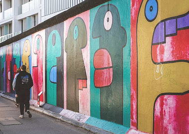 Berlin, Germany I Berlin Wall street art with colorful mural and people walking capturing a vibrant urban street scene photography full of graphic pop art graffiti energy and alternative city vibes