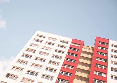 Berlin, Germany I Urban city architecture with geometric pastel building in red, white and yellow under spring light blue sky with minimalist Soviet Bauhaus style facade photography in perspective