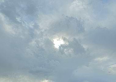 Sunlight piercing through cloudy sky