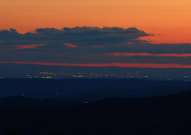 'San Joaquin Sunset' over distant city lights