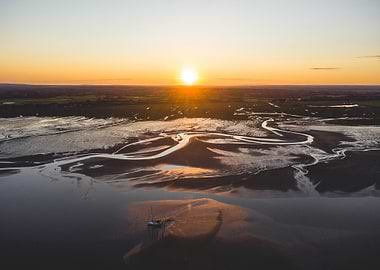 Sunset over tidal flats landscape