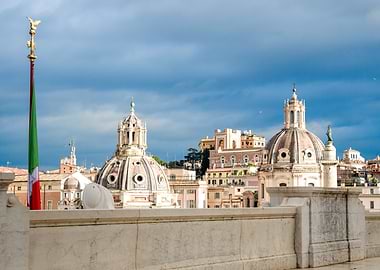 Rome cityscape with domes and flag