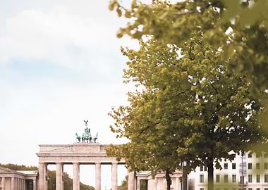 Berlin, Germany I Poetic view of the Brandenburg Gate framed by spring tree with iconic architecture bathed in soft pastel tones aesthetic blending city urban heritage and delicate nature photography