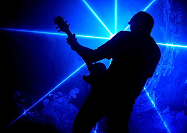 Silhouette Guitarist with Blue Laser Lights