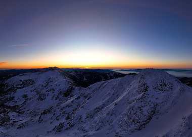Snowy Mountain Peaks at Sunrise