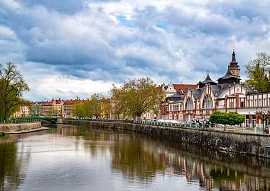 Riverfront cityscape with historic buildings