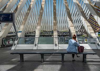 Woman sitting on bench in station