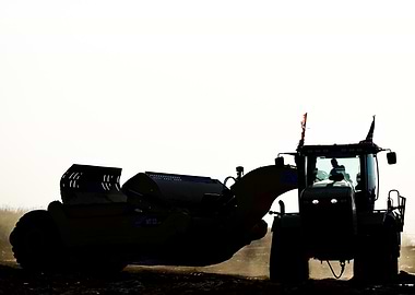 Silhouette of Tractor with Scraper Pan