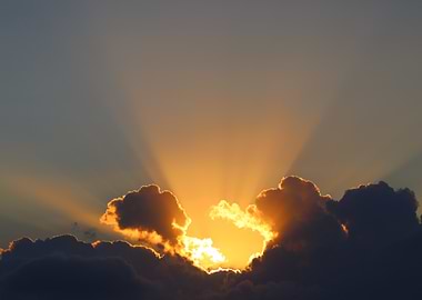 Golden Sunset Through Clouds
