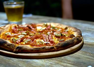 Delicious Pizza with Ham and Olives