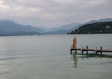 Figure on a dock at lake