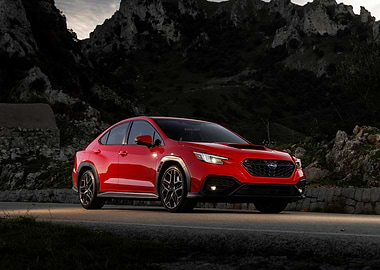 Red Subaru WRX on Mountain Road