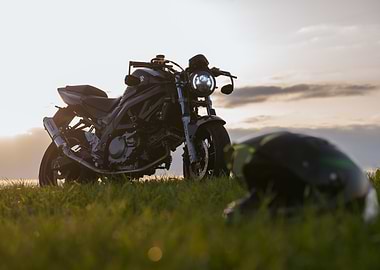 Motorcycle on Grass at Sunset