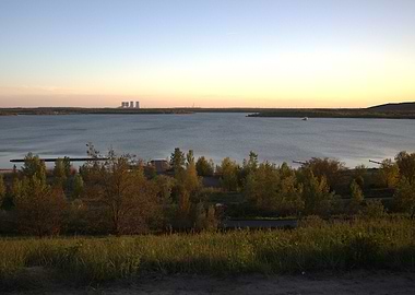 Lake view at sunset with power plant
