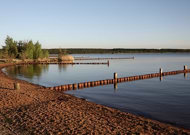 Calm Lake Scene with Wooden Barriers