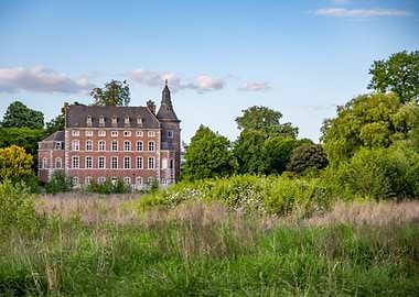 Brick castle with green surroundings