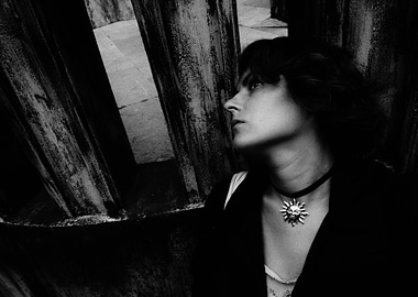 Monochrome Portrait of Woman with Sun Pendant