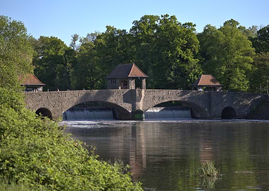 Stone Bridge over River with Weirs