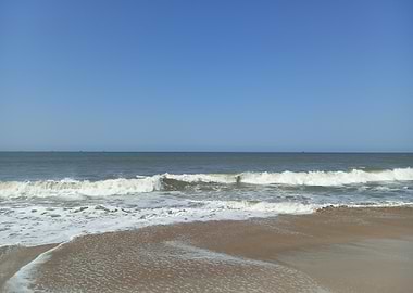 Ocean waves on sandy beach