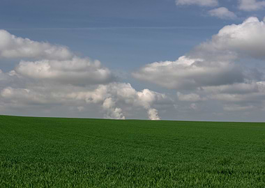 Green Field Under Cloudy Sky