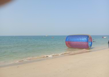 Beach with Inflatable Water Roller