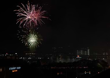 Fireworks over city at night