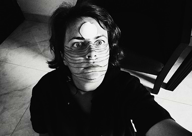 Monochrome portrait with face paint and shell