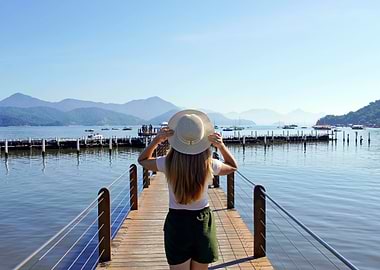 Woman on Pier with Scenic View