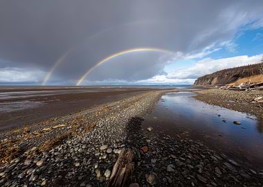 Double Rainbow Over Coastal Landscape