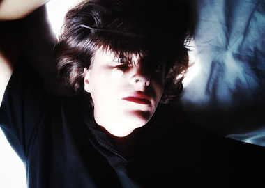 Woman in Shadow with Feather