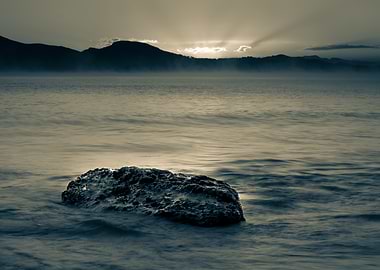 Monochromatic Seascape with Rock and Sunrise