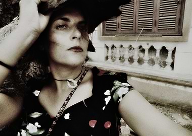 Woman in Floral Dress and Hat